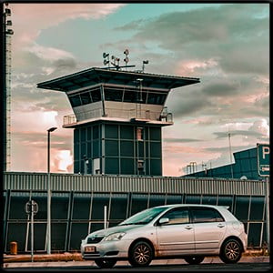 Transportation from Duluth to MSP with a car parked outside the airport